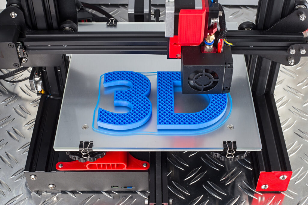 Red black 3D printer creating blue logo symbol