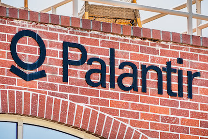 Brick building with Palantir logo and text saying "Palantir."