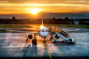 24794923 - airplane near the terminal in an airport at the sunset