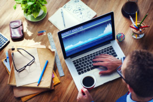 34406840 - man analysis the market on computer