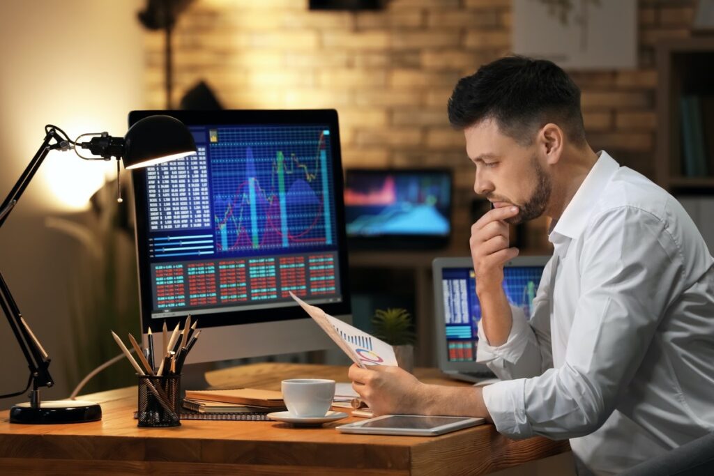 A stock trader looking at a chart