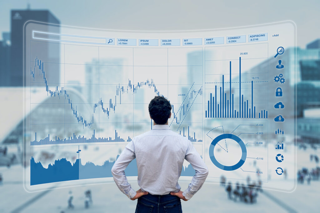 man looking at graphs
