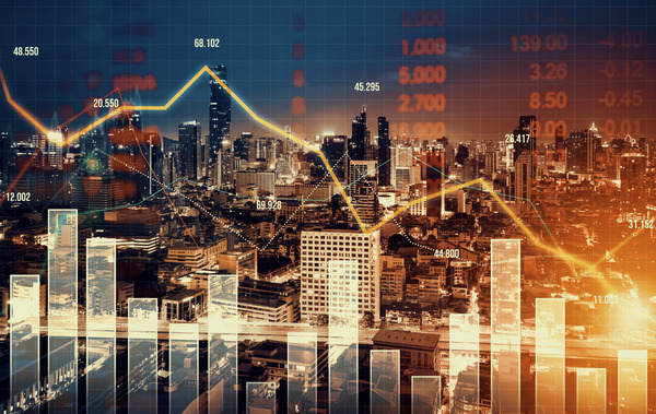 Declining graphs and digital indicators against a modernistic city background