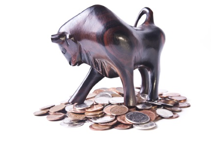A strong, triumphant bull atop a pile of coins, signifying an optimistic or bullish foreign currency (forex) market.