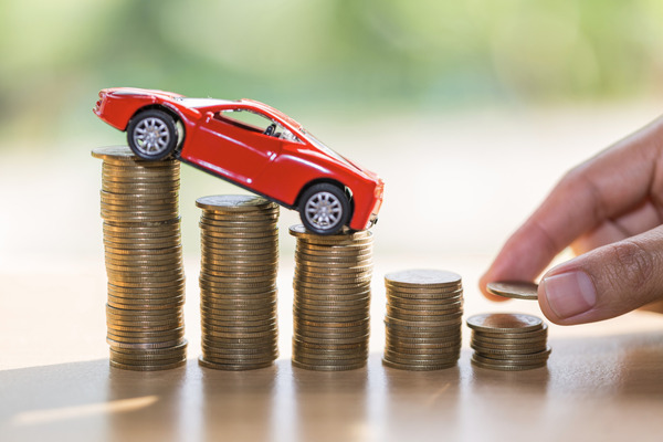 Model car on stacks of coins