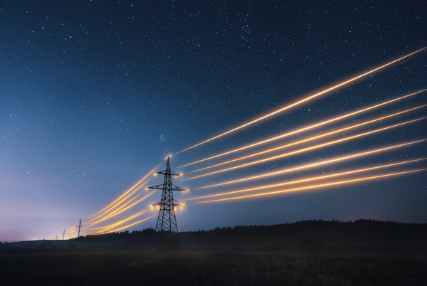 Pylons connected with glowing power lines