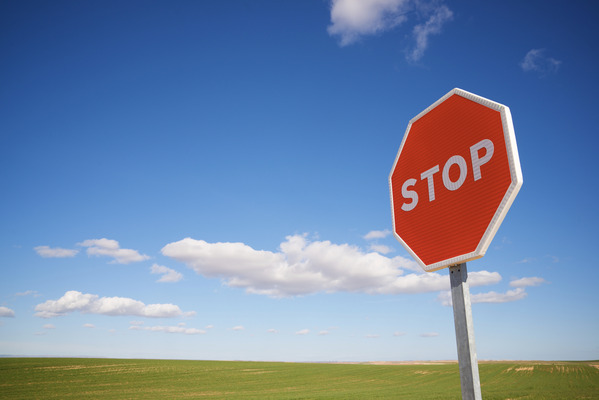 Stop traffic sign with cloudy sky