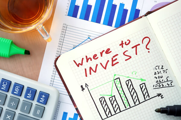 Different types of stocks: Where to INVEST? written in a notebook