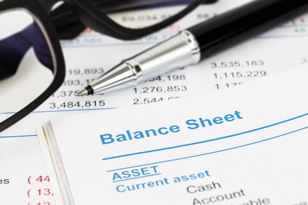 Eyeglasses, pen and a Balance Sheet