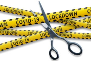 The end of the Covid 19 pandemic. Scissors cut yellow ribbons with text Covid-19 LOCKDOWN