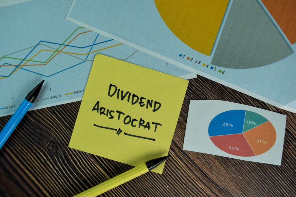 dividend stocks for retirement: dividend aristocrat written on a yellow sticky note