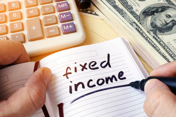 Best fixed income investments: fixed income written in a notebook