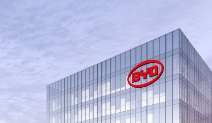 BYD auto signage logo on top of glass building. workplace car company office headquarter.