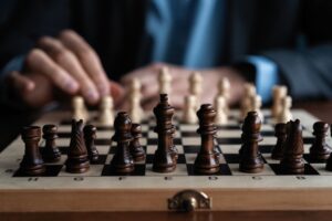 Businessman play with chess game. concept of business strategy and tactic