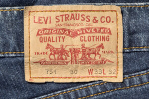 Chisinau, Moldova - August 19, 2016: Closeup of Levi's leather jeans label sewed on a blue jeans isolated on white background.Levi Strauss & Co is a privately held American clothing company.