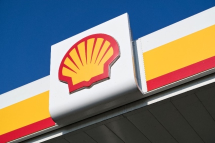 Shell sign against blue sky. shell is an Anglo-Dutch multinational oil and gas company headquartered in the Netherlands and incorporated in the U.K.]]