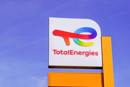 TotalEnergies sign at a gas station. TotalEnergies is a French energy provider mostly focused on the fossil fuels space.