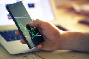 Trader montor chart on smart phone, financial theme.