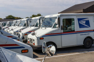 Indianapolis - Circa August 2019: USPS Post Office Mail Trucks. The Post Office is responsible for providing mail delivery IX