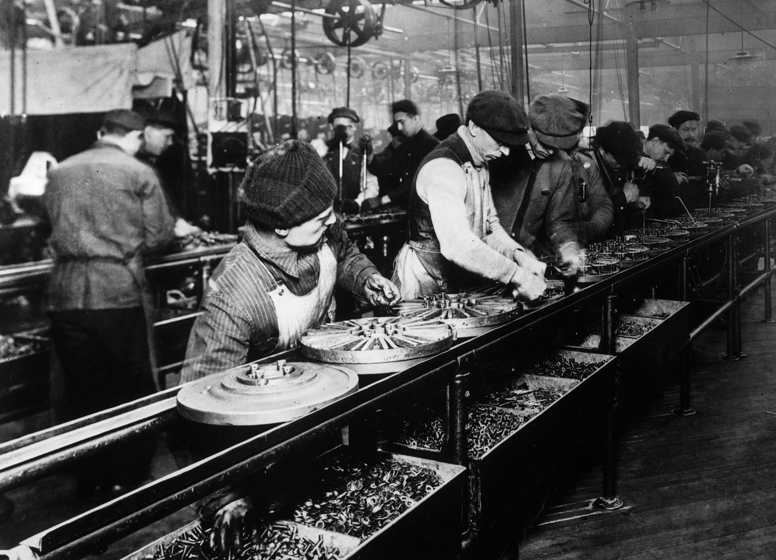 People working on a factory assembly line.
