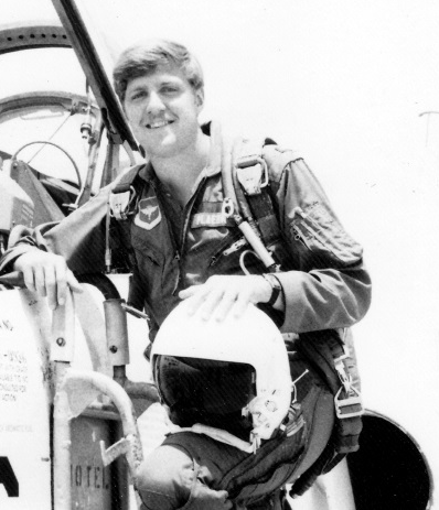 Picture of Tim Plaehn next to his F16.