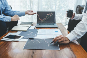 Businessman on meeting conversation and collaboration discussing of partner cooperation to planning in investment trading marketing project to investor of deal on a stock exchange to business profit.