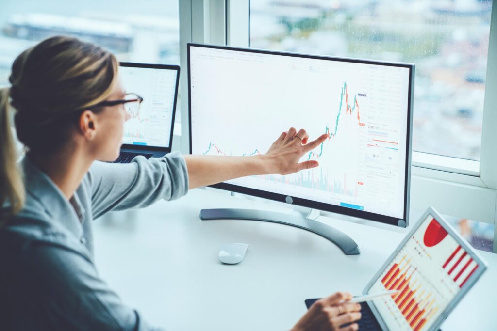 covered call strategy: woman pointing at her computer screen