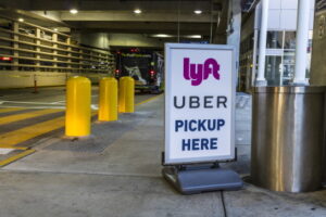 Indianapolis - Circa July 2017: Ride sharing companies Lyft and Uber pickup spot at the airport. Lyft and Uber have replaced many Taxi cabs for transportation I