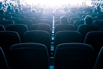 Movie theater from seats near the rear.