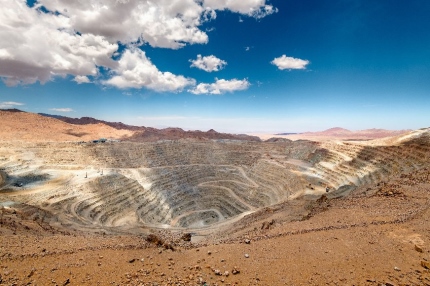 View from above of the pit of an open-pit copper mine in Chile