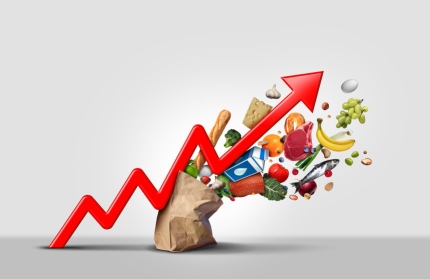 Graphic representation of inflation bursting through a bag of groceries to represent increasing food prices.
