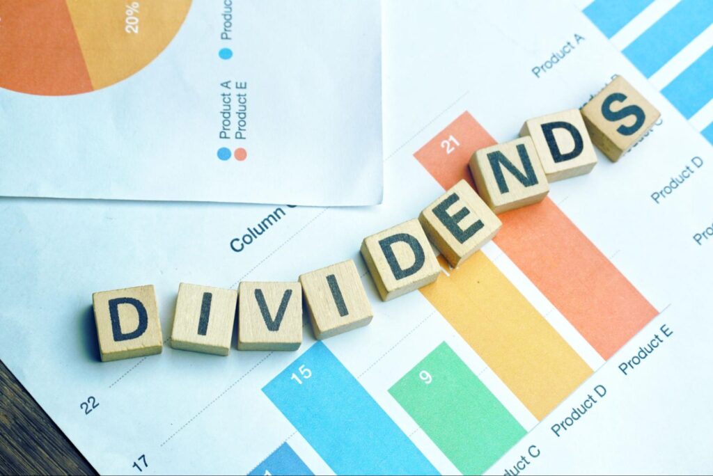 dividend stocks for retirement: small blocks used to spell out the word dividends 