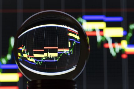 Stock market chart viewed through a crystal ball to make it clearer.