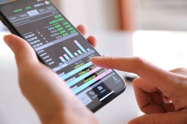 Covered call writing: trading stocks using a mobile phone