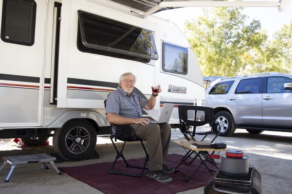 Tim Plaehn with travel trailer